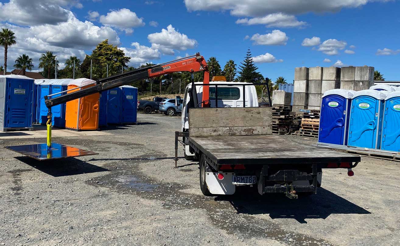Hiab unloading a steel road plate