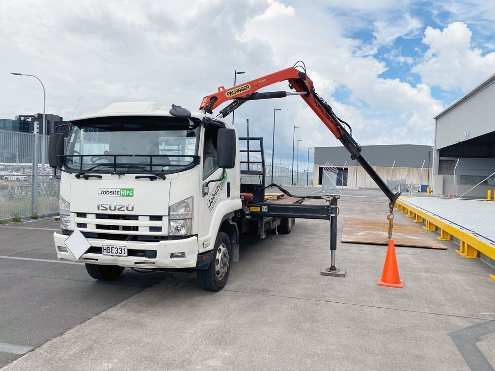 Hiab unloading a steel road plate